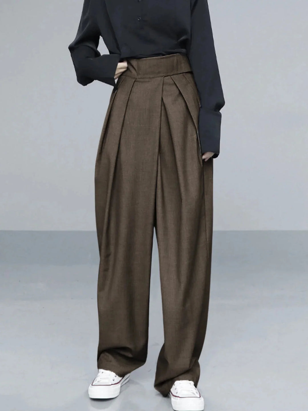"Dark brown wide-leg pants with adjustable fit for comfort, made from high-quality fabric."