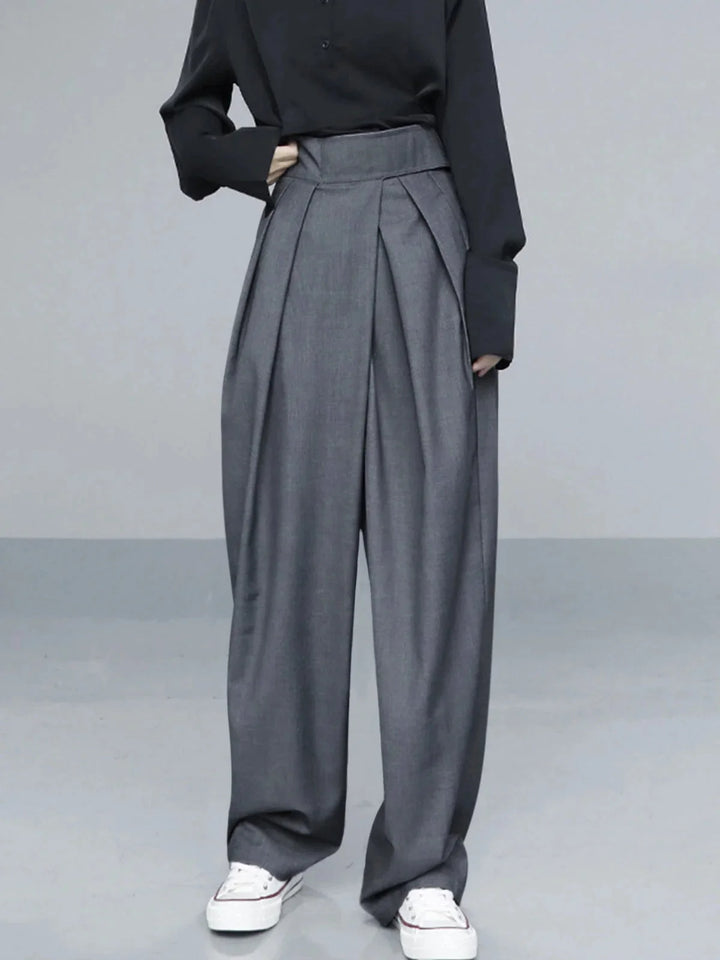 Gray wide-leg pants with adjustable fit. Made with durable, comfortable fabric. Perfect for a casual yet stylish look.