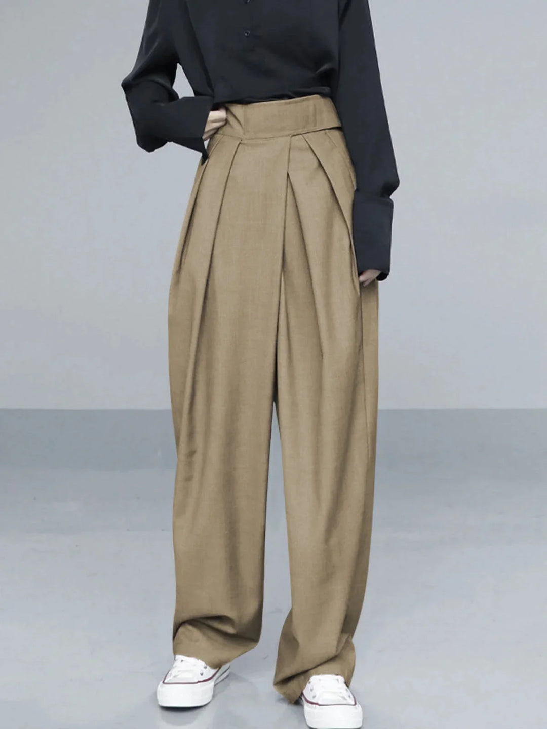 Khaki wide-leg pants with adjustable fit from Adelyne. Made with soft, breathable fabric for all-day comfort and versatile…