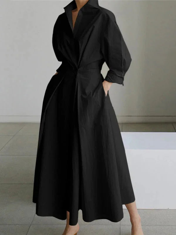 Black Ellowyn dress with a flowing collar and cinched waist, perfect for effortless style.