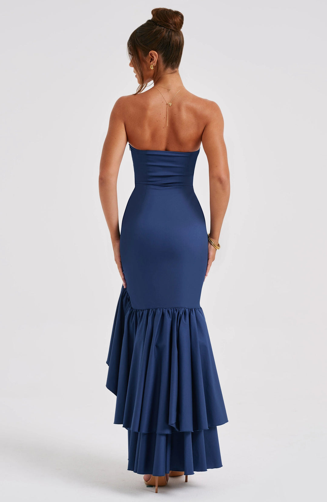 Strapless dress with asymmetrical ruffle skirt, crafted in soft cotton blend fabric, perfect for a chic and stylish look.