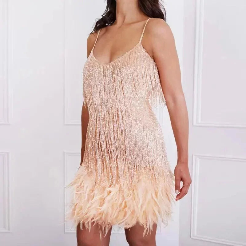 "Emberly spaghetti strap mini dress featuring sequins and feathers, perfect for a glamorous and chic evening look."