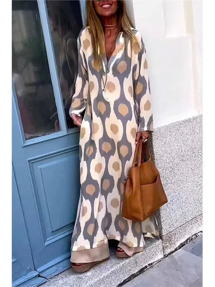 "Zeppelin long-sleeve maxi dress in black with a flattering V-neck design and flowy fit, perfect for all-day comfort and…