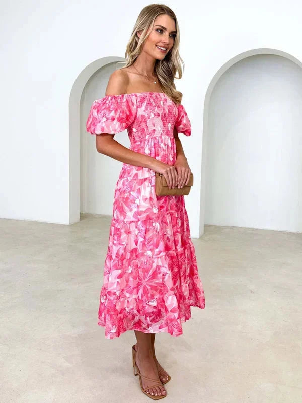 "Kenley summer dress with tiered flowing design and floral print, perfect for summer outings and events."