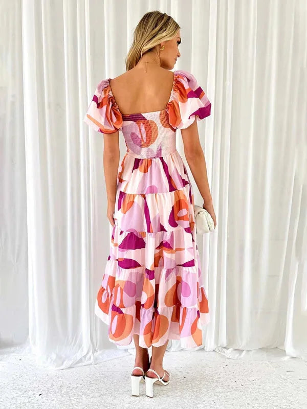 "Kenley summer dress with flowing tiered floral pattern, perfect for a breezy look. Made from lightweight fabric in a…