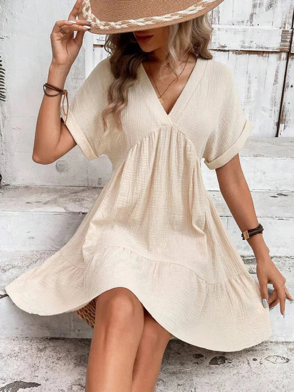 "Rosabelle dress in flowing chiffon fabric with v-neck and cascading ruffles"