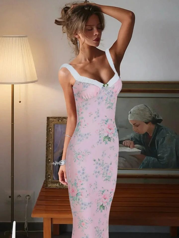 Pink floral maxi dress with ruffle details, perfect for spring. Made of soft cotton blend, features a flattering silhouette…