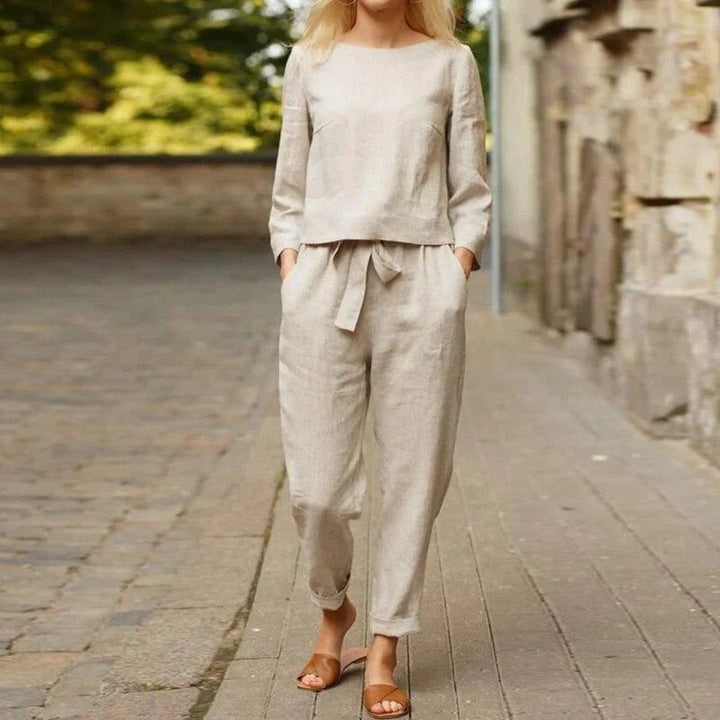 "Rylynn - Women's breezy two-piece linen set in soft pastel blue color with cropped top and wide-leg pants, perfect for a…