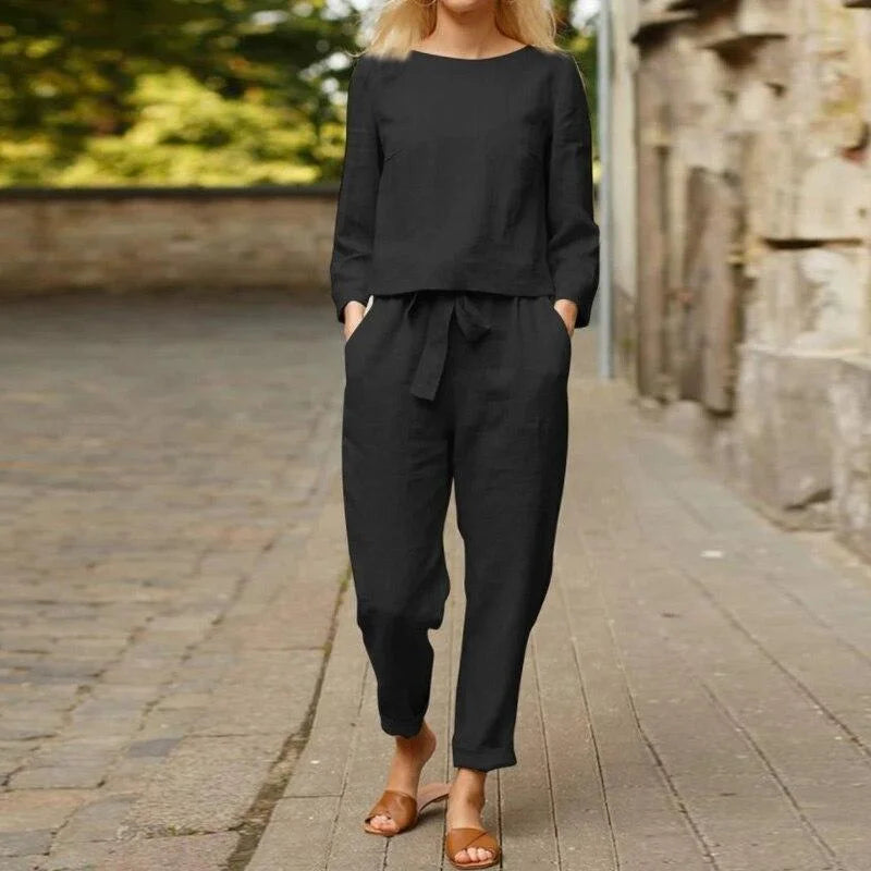 "Black two-piece linen set for women, featuring a breezy design perfect for warm weather, includes top and pants by Rylynn."