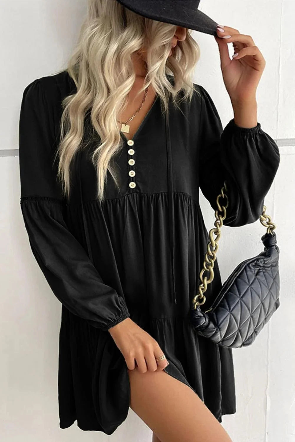 "Gabriella tiered mini dress with lace-up front in soft cotton blend fabric, adorned with delicate lace details"