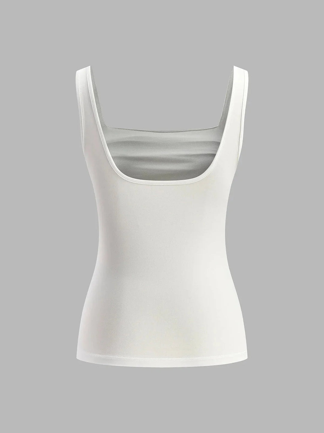 "Sleeveless ruched top in coral color. Versatile design, perfect for layering or worn alone for a chic look."