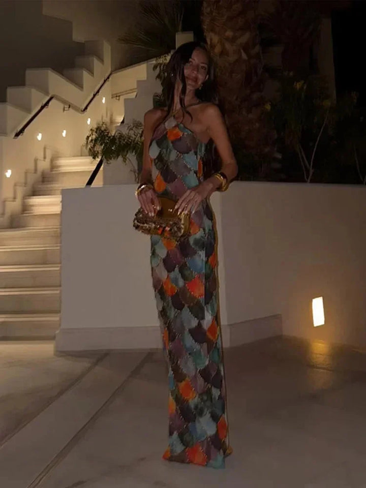Multicolor floor-length dress with halter neck, perfect for special events or evenings out. Made from lightweight,…