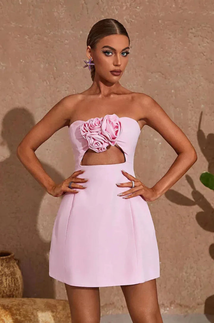 Strapless mini dress featuring floral accent, made with Kaileen-embellished fabric in a flirty silhouette.