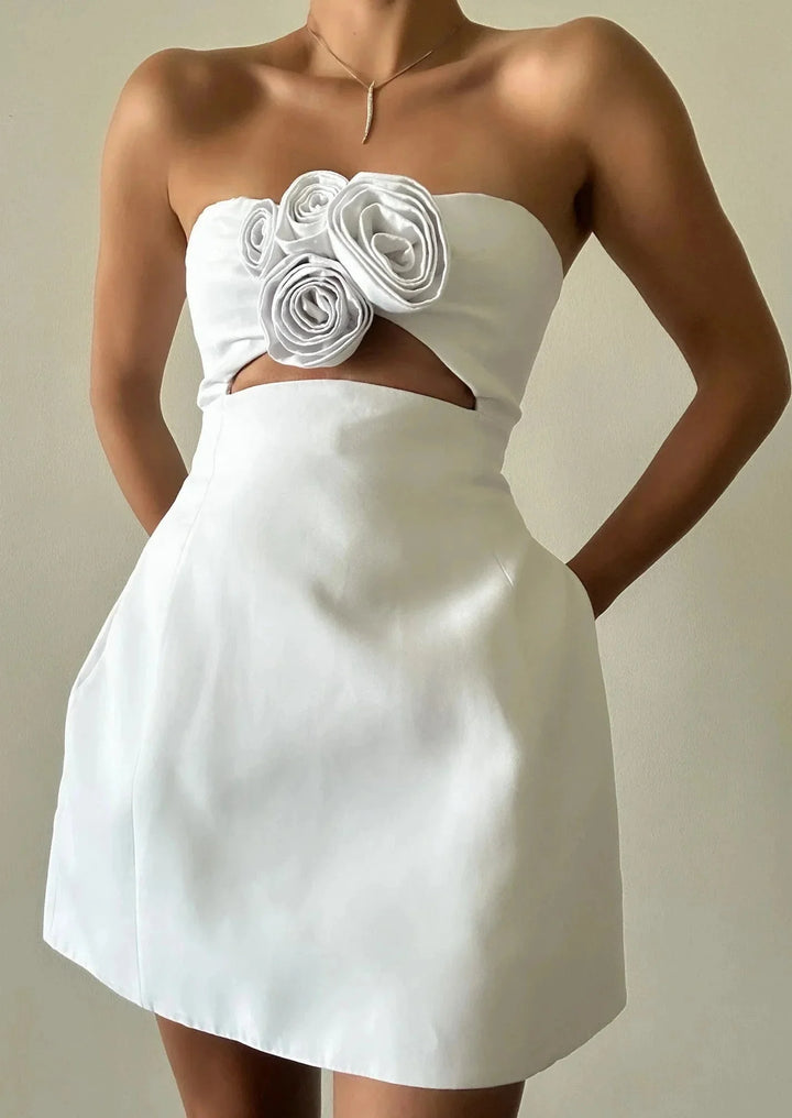 Strapless mini dress with floral accent made of Kaileen-like material, perfect for special occasions or evenings out.