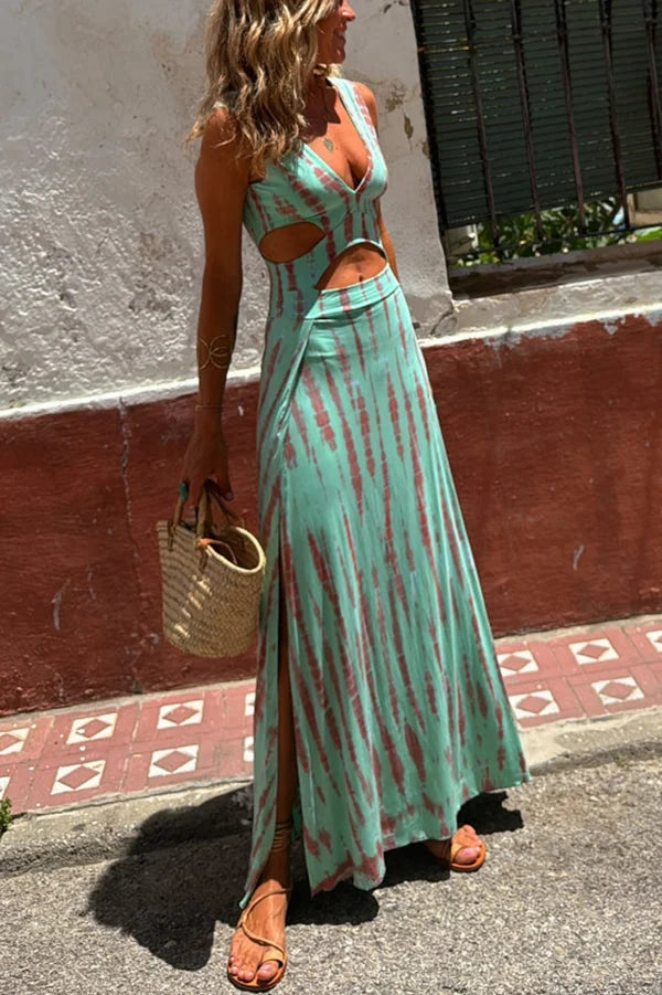"Calypso tie-dye dress with plunging neckline and side split, made of soft and flowing fabric, perfect for casual chic summer…