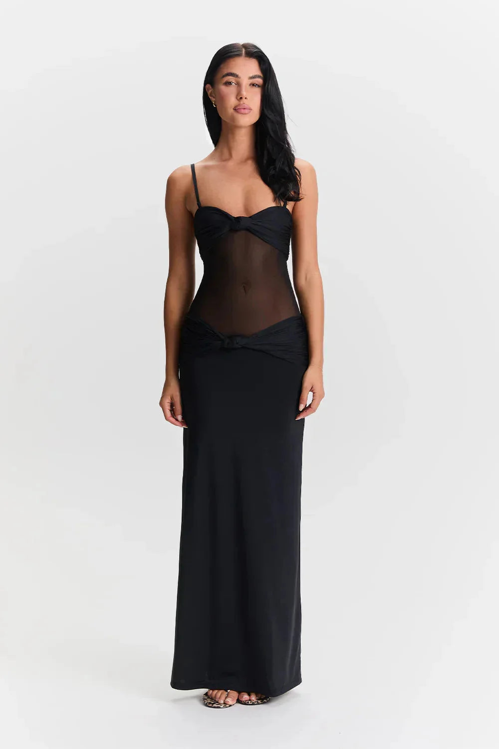 Women's strapless maxi dress with mesh bodice in black, perfect for evening events. Made of flowy fabric with a trendy mesh…
