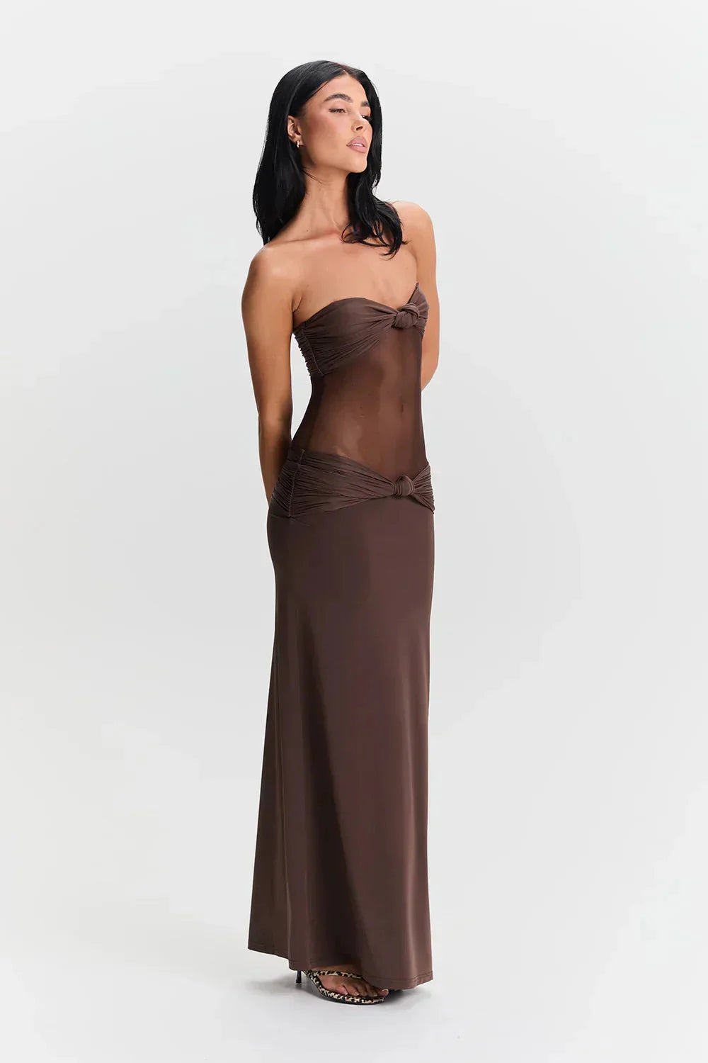 Black strapless maxi dress with mesh bodice for women by Jaylyn. Features a stylish and elegant design perfect for formal…