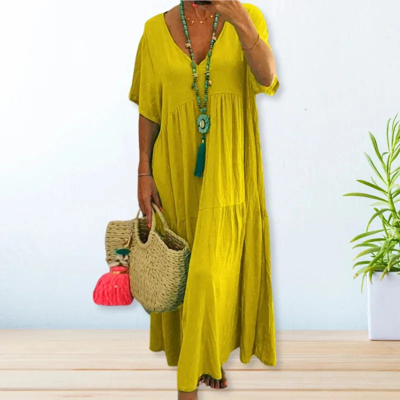 Yellow V-neck maxi dress by Constance, perfect for summer. Lightweight fabric with a flowy silhouette, ideal for warm weather…