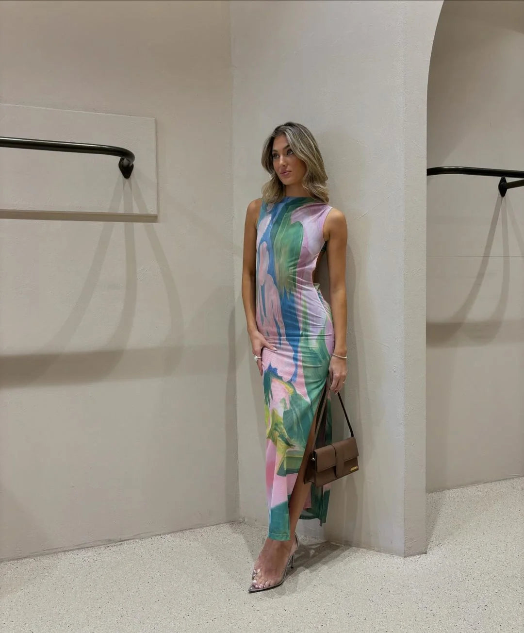 "Sleeveless tropical print maxi dress with vibrant floral patterns on a soft and flowy fabric, perfect for summer outings…