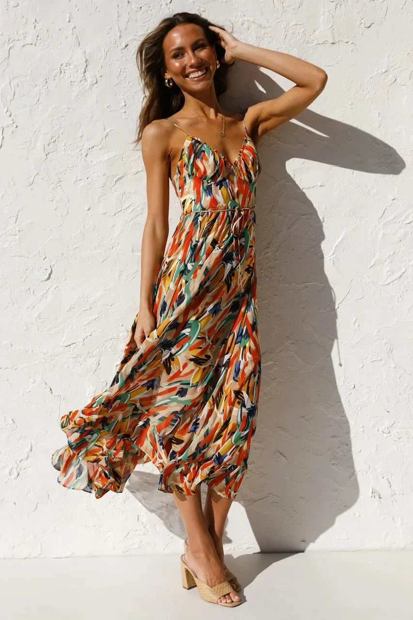"Laci maxi dress in flowy silhouette, featuring vibrant print of abstract design in lightweight fabric, perfect for a…