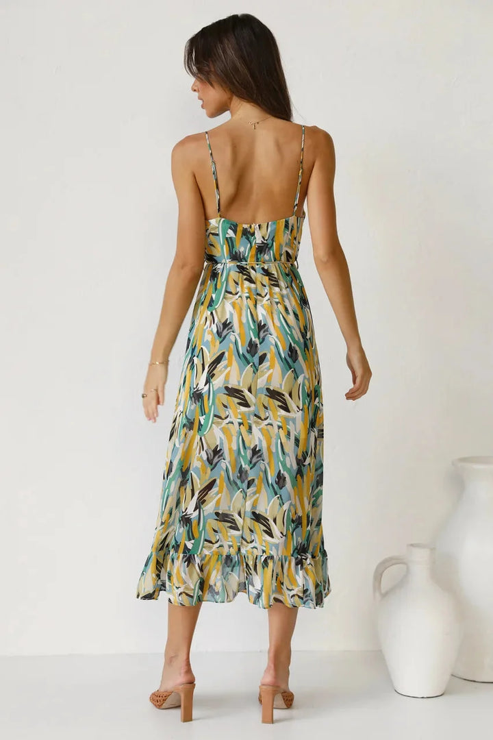 "Laci - Flowy maxi dress with vibrant abstract print, featuring soft and breathable fabric ideal for summer outings."