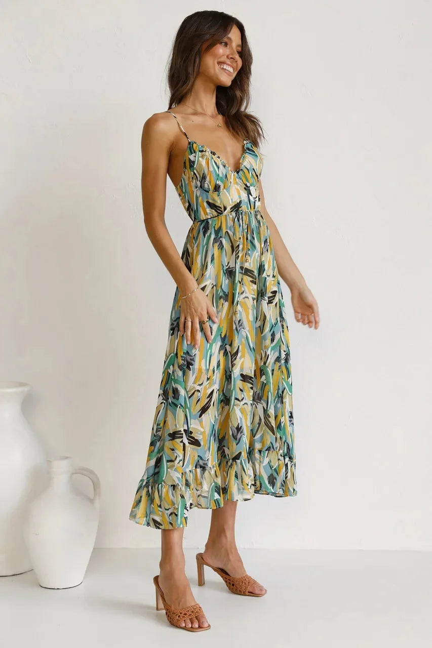 "Vibrant print flowy maxi dress by Laci, featuring a lightweight, airy fabric perfect for a fashionable, effortless summer…