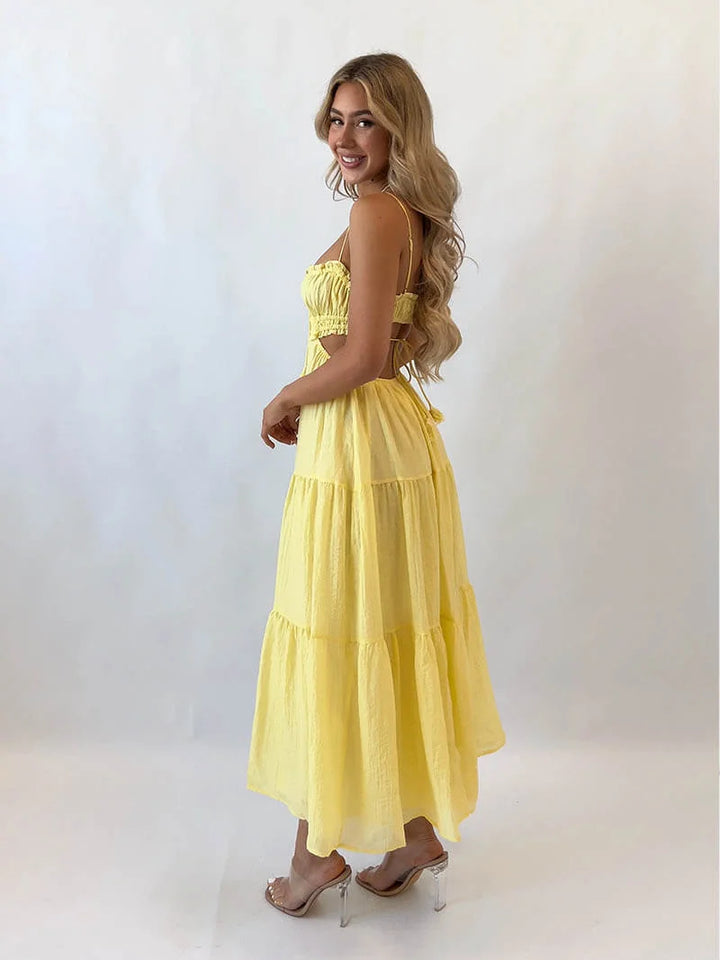 "Jo tiered maxi dress in floral print with adjustable drawstring waist, perfect for a casual day out or beach vacation."