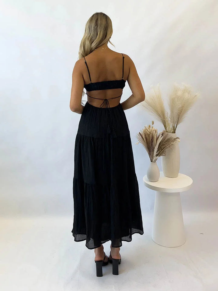 "Jo tiered maxi dress in light and flowing fabric with drawstring waist, perfect for effortless summer style."