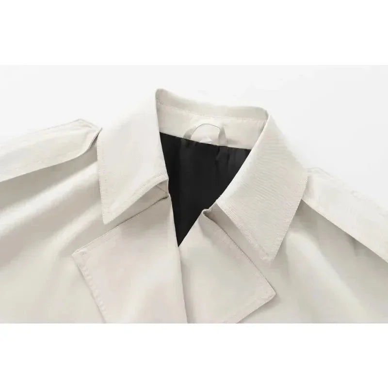 Ivory structured double-breasted jacket with a defined silhouette and button detailing crafted from premium quality fabric.