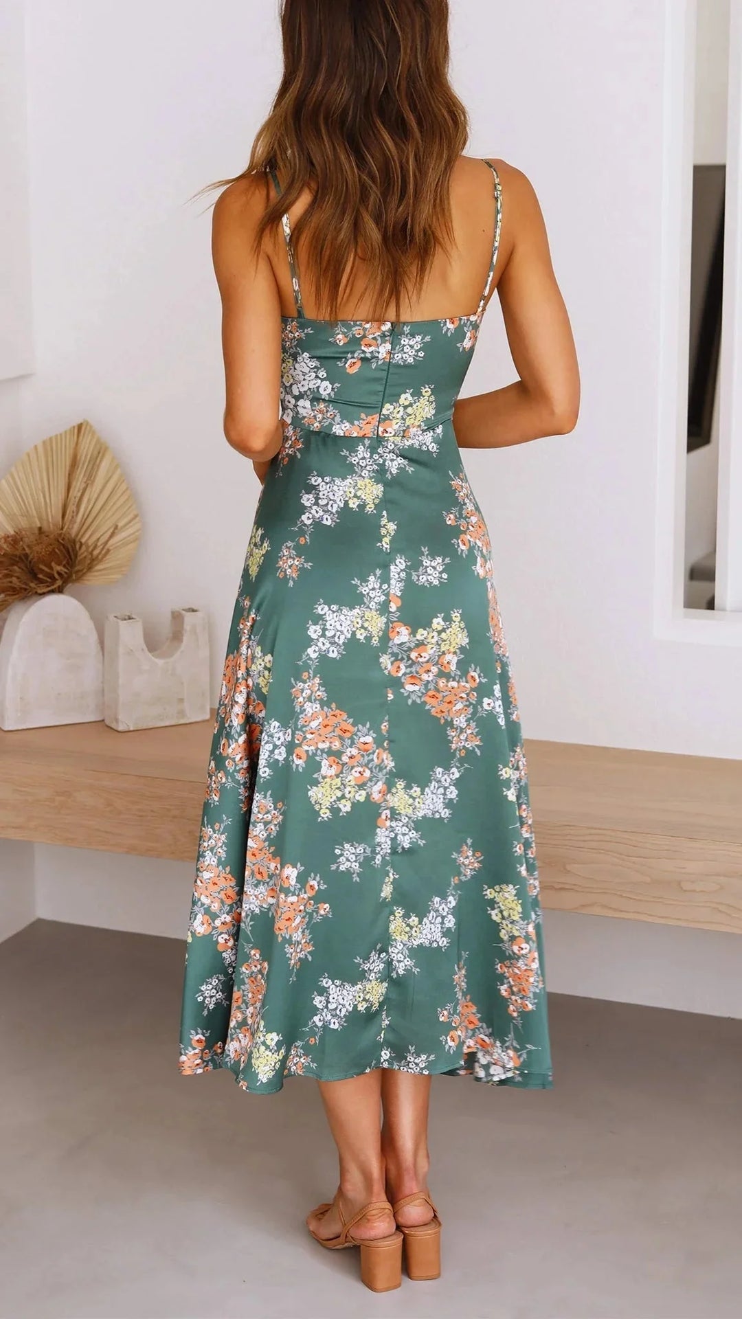 Teal floral satin dress with front tie, elegantly designed with a Avanna floral print and a stylish front tie detail.