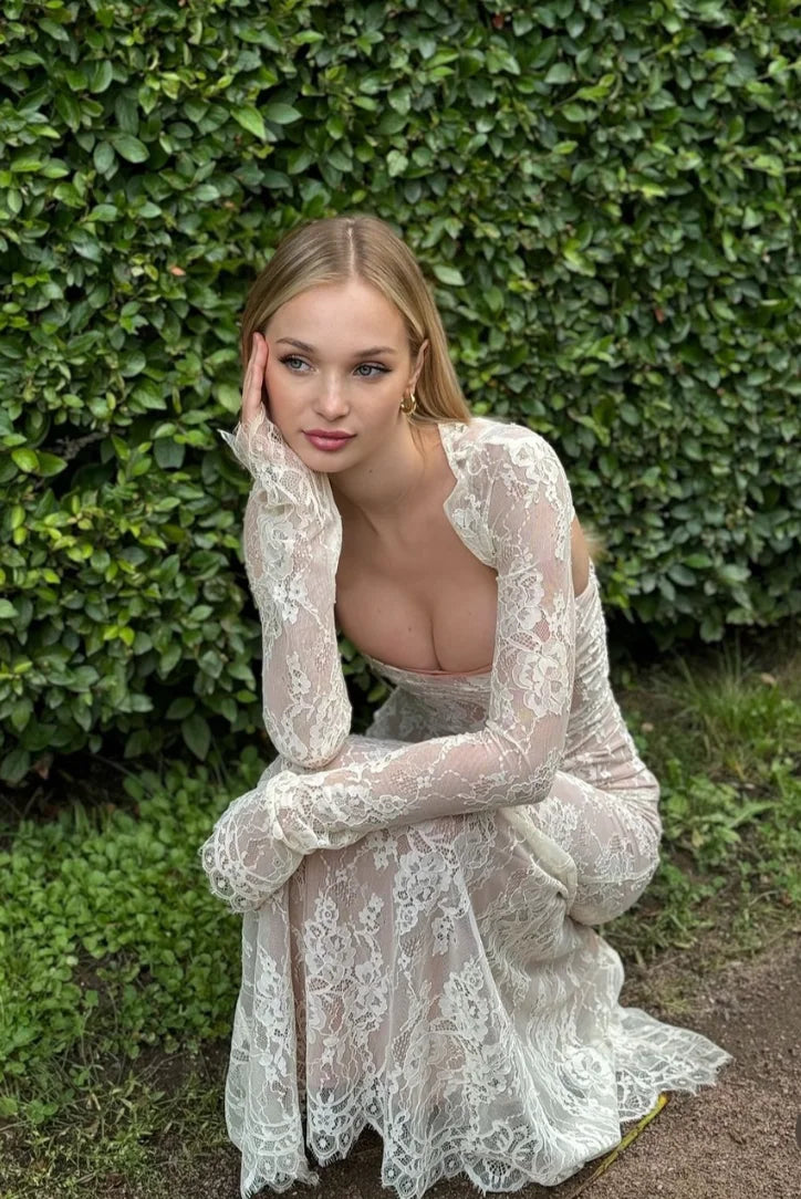 White lace dress with sleeves, Muslima brand. Elegant and classic design, perfect for special occasions or everyday wear.