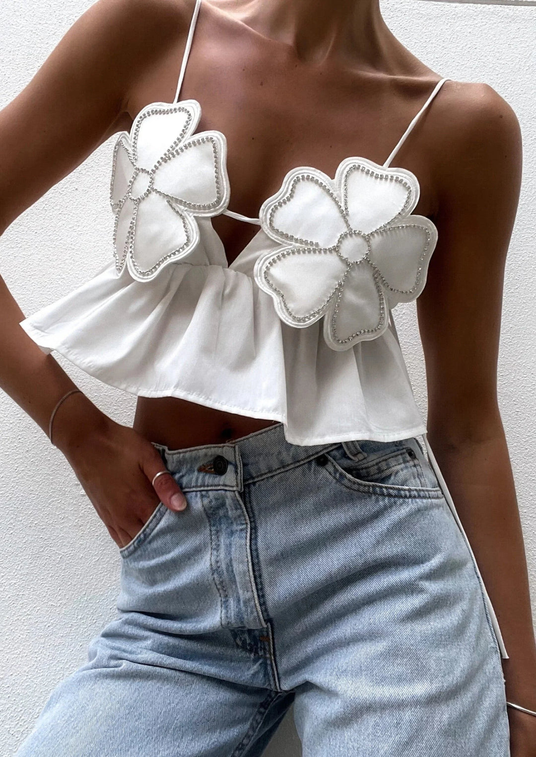 "Aryanna crop top with intricate floral applique design and delicate lace detailing."