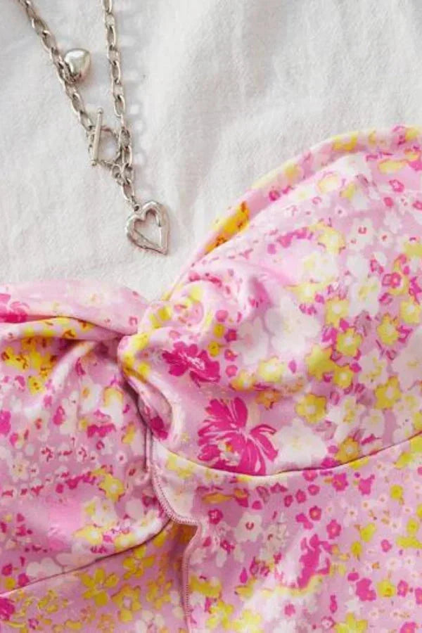 Pink floral cut-out maxi outfit featuring a feminine and chic design with intricately detailed patterns.