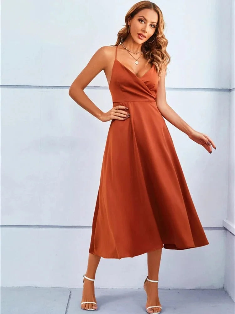 "Sleeveless silk midi dress with adjustable straps in Klaire design, perfect for casual or formal occasions."