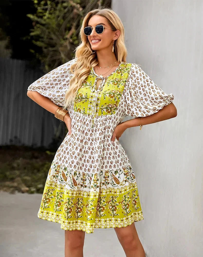 Laniyah mini dress with elastic waist and V-neck, made of soft cotton blend. Ideal for casual outings or leisurely strolls.
