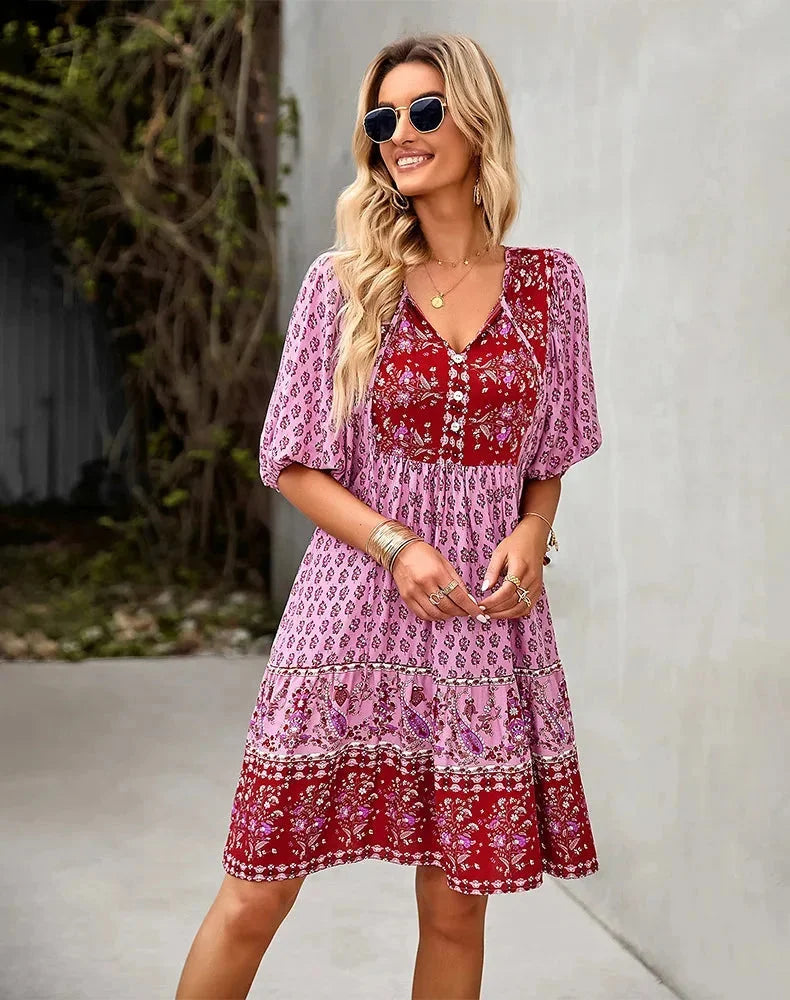 "Laniyah mini dress in black with elastic waist, V-neck design, and above-the-knee length, perfect for casual outings and…