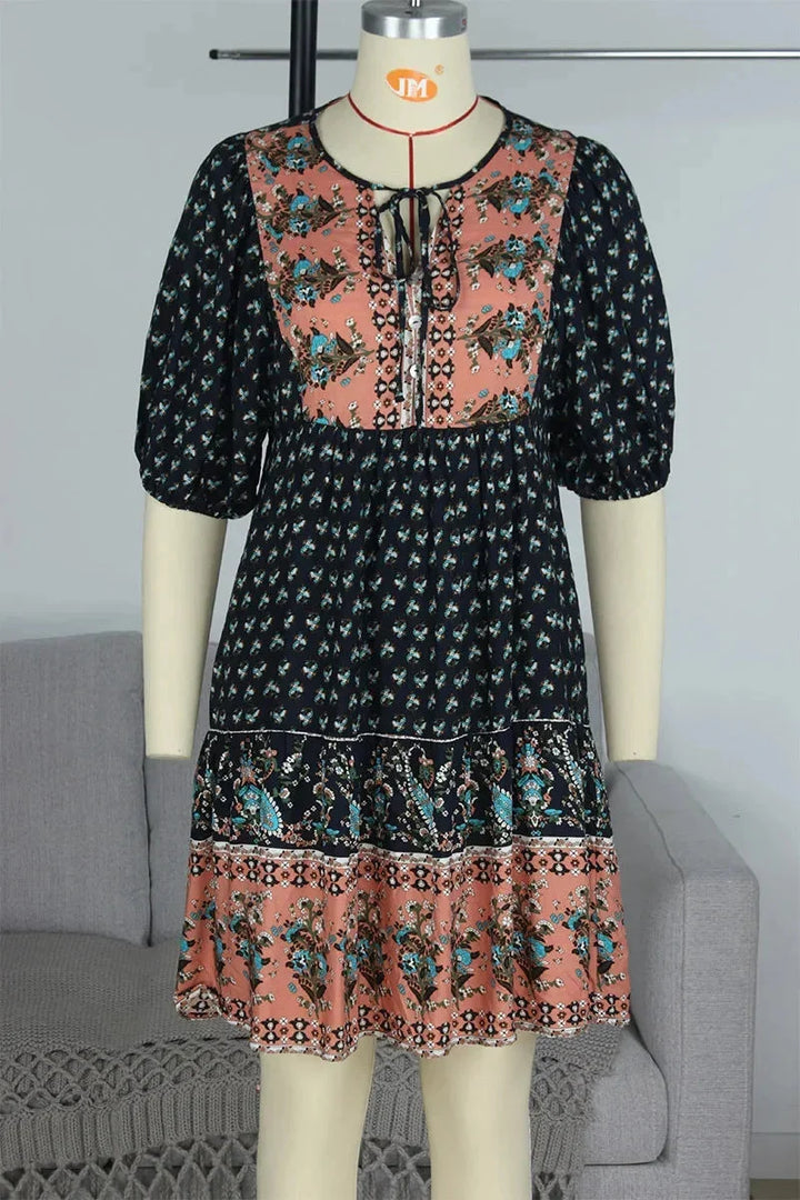 Laniyah mini dress featuring a comfy elastic waist, fashionable V-neck design, and a chic mini length in soft and flowy fabric.