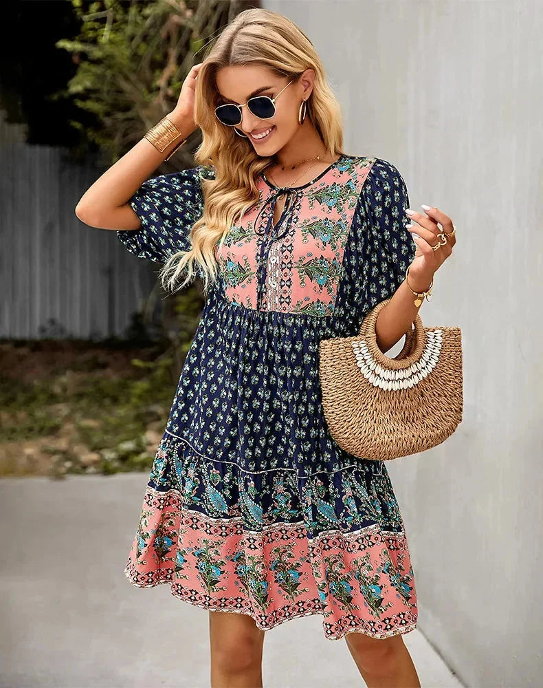 Laniyah mini dress in black with elastic waist and V-neck, perfect for casual outings or evening events.