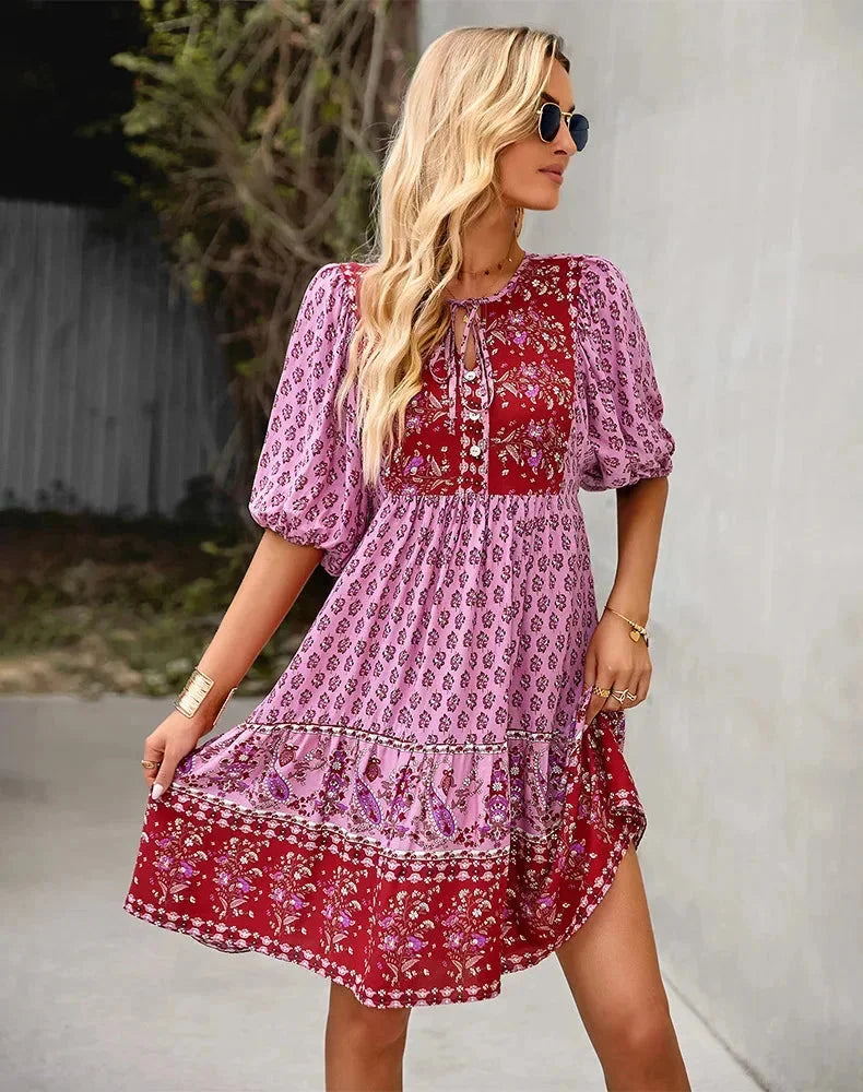 Laniyah - A stylish mini dress with an elastic waist, V-neck design and flowy silhouette in a soft, comfortable fabric.