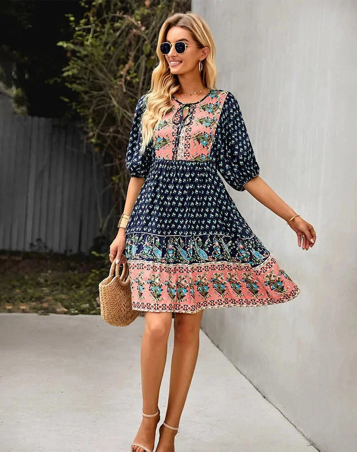 "Laniyah - Black elastic waist V-neck mini dress in soft jersey fabric, perfect for casual outings or everyday wear."