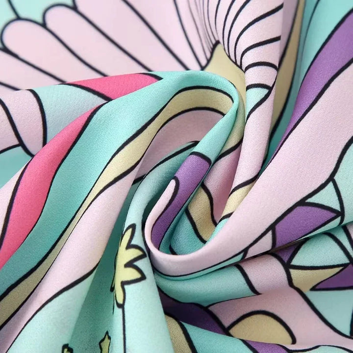Sleeveless pastel mermaid print dress with a fitted silhouette, featuring a whimsical design in soft, breathable fabric.