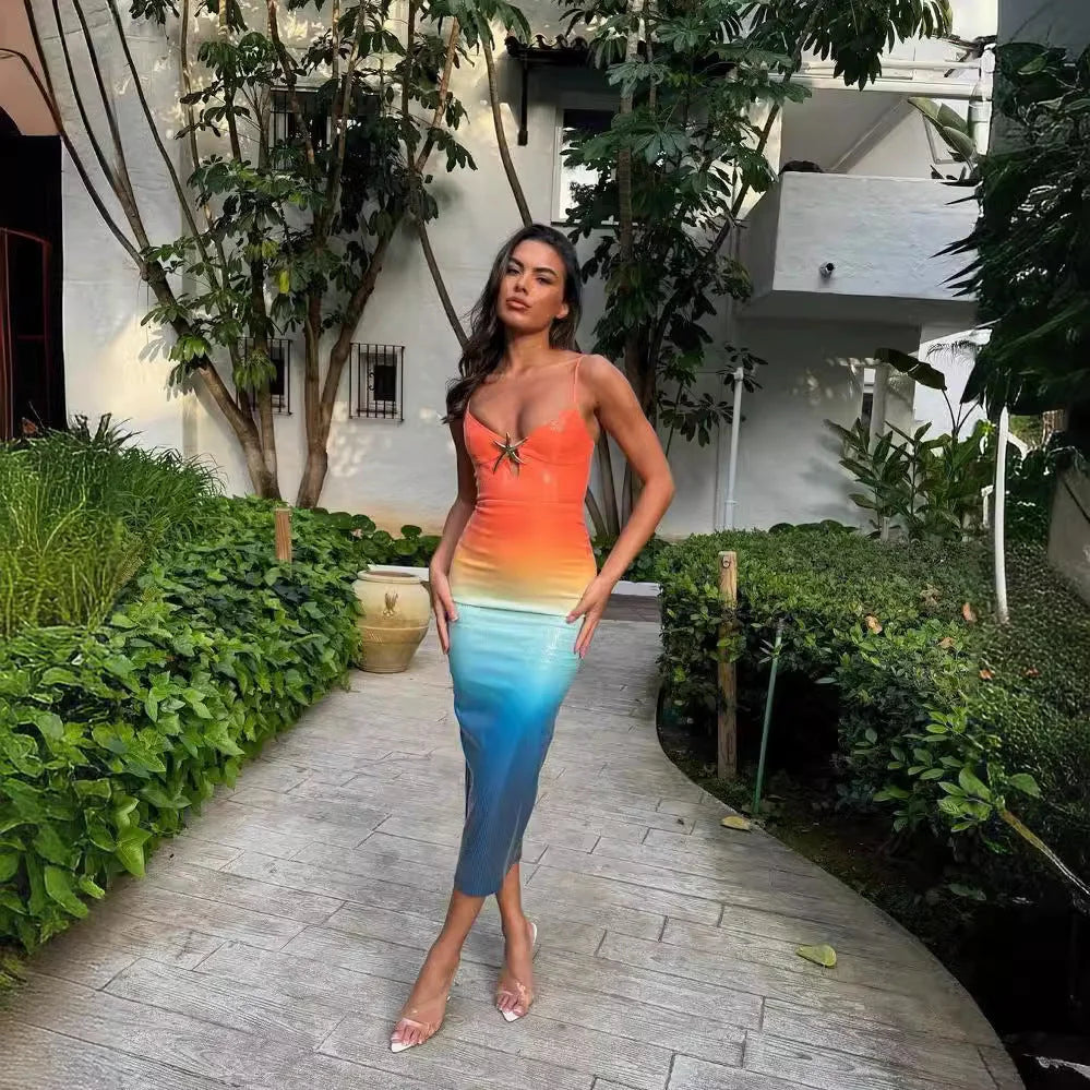 "Bellamie midi dress in sunset ombre design with starfish accents, made from lightweight and breathable fabric."