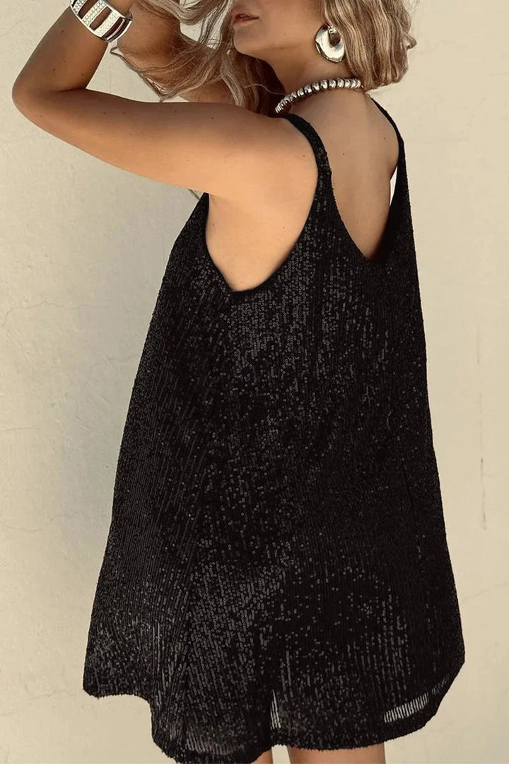 Sleeveless black romper with V-neck adorned with sparkly sequins for a glamorous look.
