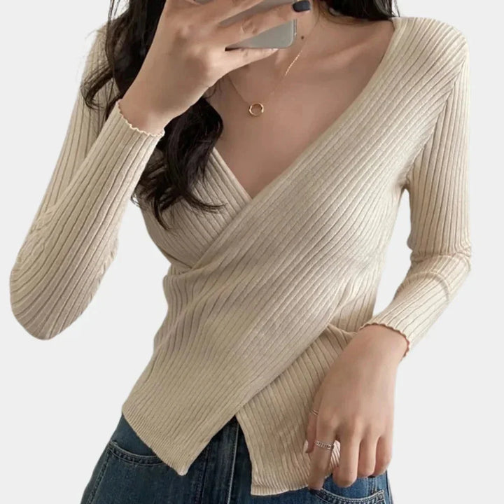 Beige ribbed V-neck wrap top with a flattering design, perfect for casual or dressed-up occasions.