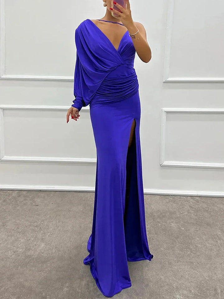 Blue one-shoulder dress with side slit made of flowing fabric, a sleek and stylish choice for special occasions.