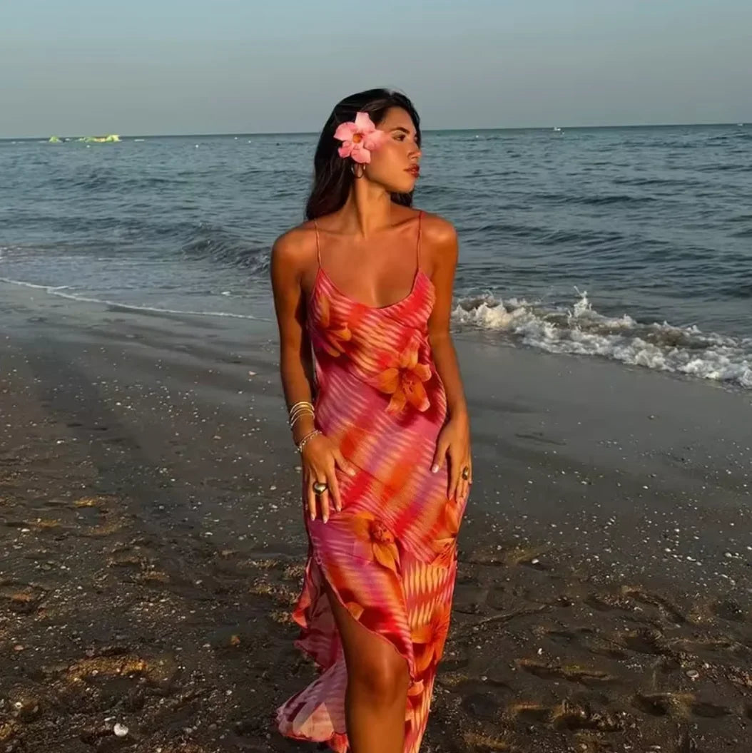 Alana beach dress in vibrant tropical print, flowy and colorful design perfect for sunny days, made from lightweight and…