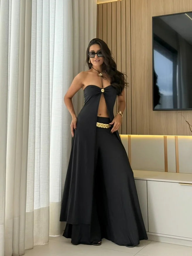 "Black two-piece palazzo and crop top set by Emery. Features lightweight, flowy fabric and trendy design. Perfect for a…