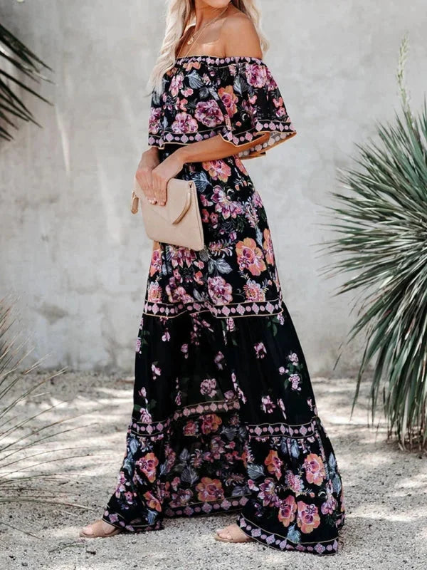 "Amyla maxi dress with floral print, tiered design, and belt detail in lightweight fabric."