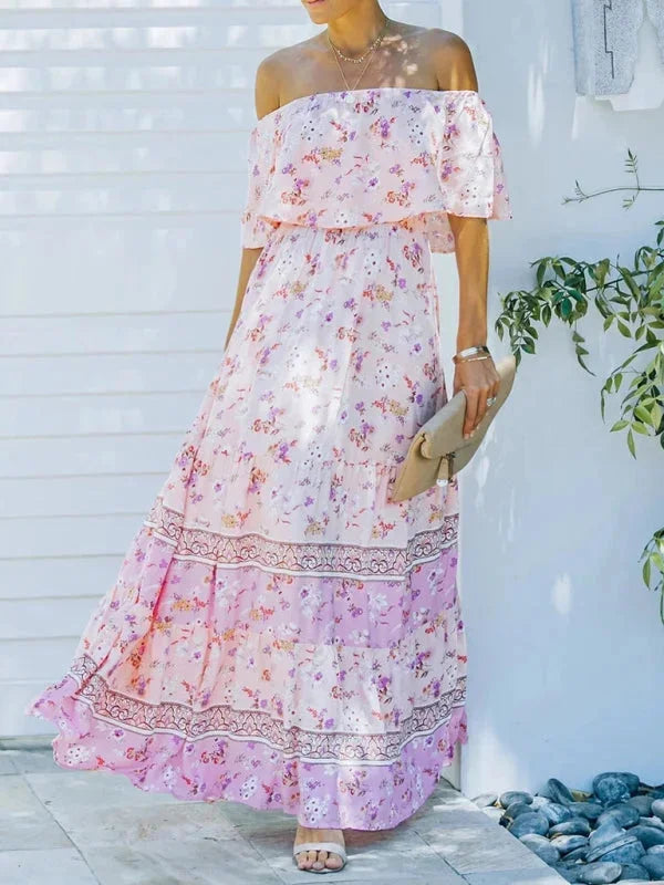 "Amyla - Tiered maxi dress with belt, featuring a floral pattern and flowy silhouette in lightweight fabric."