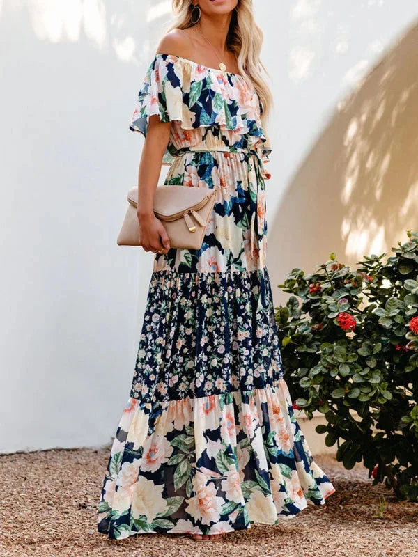 "Amyla - Tiered maxi dress with belt featuring elegant floral print, flowing design, and summery lightweight fabric."